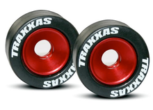 Load image into Gallery viewer, Traxxas 5186 Rubber Tires Mounted on Red-Anodized Aluminum Wheelie Bar Wheels (pair)
